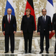 Belarus' President Alexander Lukashenko (L), Russia's President Vladimir Putin (2nd L), Ukraine's President Petro Poroshenko (R), Germany's Chancellor Angela Merkel (C) and France's President Francois Hollande pose for a family photo during peace talks in Minsk, February 11, 2015.